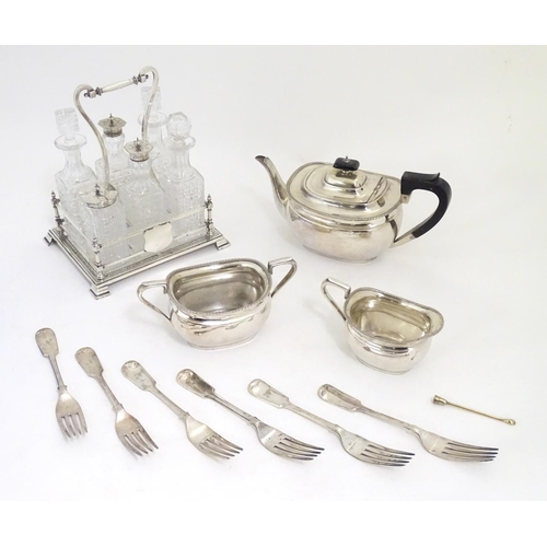 495 - Assorted silver plated wares to include table forks, 3 piece tea set and 6 bottle cruet stand and bo... 