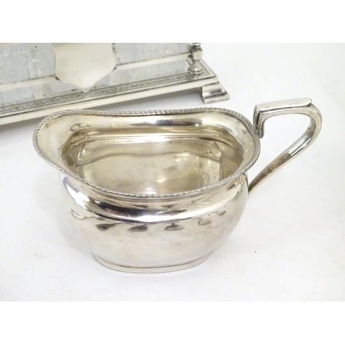 495 - Assorted silver plated wares to include table forks, 3 piece tea set and 6 bottle cruet stand and bo... 