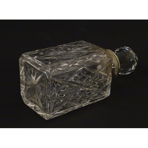 192 - A cut glass / crystal decanter with silver rim hallmarked London 1979 maker J A Campbell. Approx 9 1... 