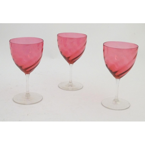 204 - Ten assorted cranberry glass drinking glasses together with two ruby glass drinking glasses with fru... 