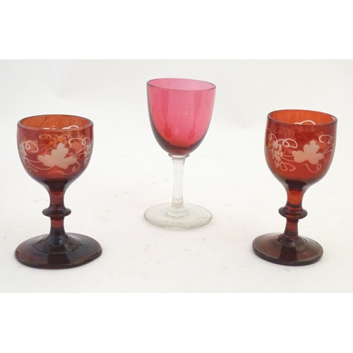 204 - Ten assorted cranberry glass drinking glasses together with two ruby glass drinking glasses with fru... 