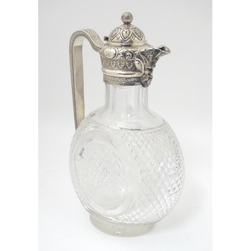 300 - Manner of Thomas Webb : A Victorian cut glass and silver mounted claret jug, the body of the jug dec... 