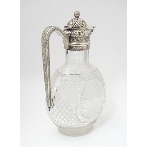 300 - Manner of Thomas Webb : A Victorian cut glass and silver mounted claret jug, the body of the jug dec... 