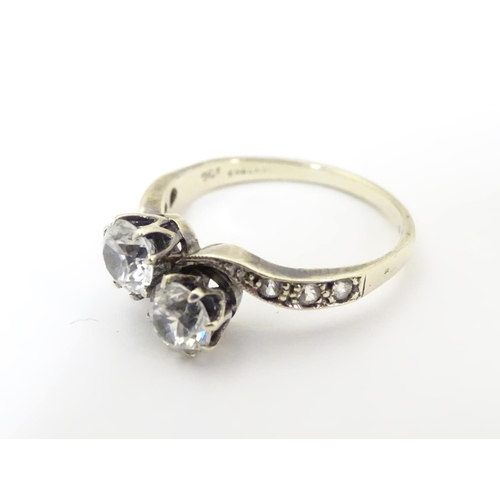 504 - A vintage 9ct gold ring set with spinel in a crossover setting. Ring size approx N