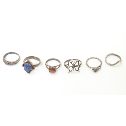 537 - Six assorted silver and white metal rings with various decoration including one set with goldstone c... 