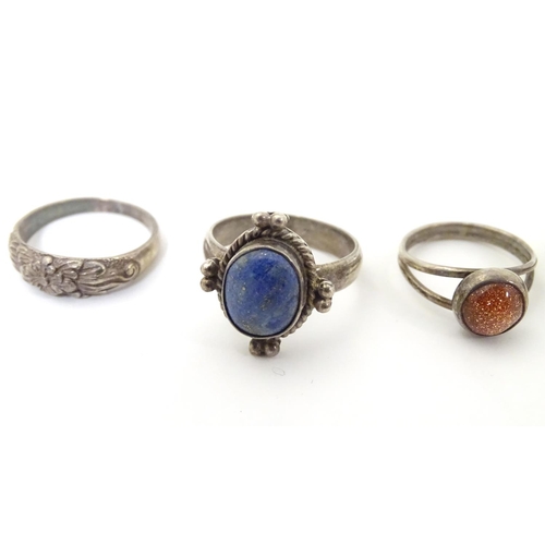 537 - Six assorted silver and white metal rings with various decoration including one set with goldstone c... 