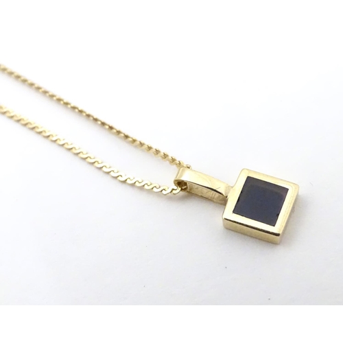 540 - A 9ct gold pendant on chain approx. 14