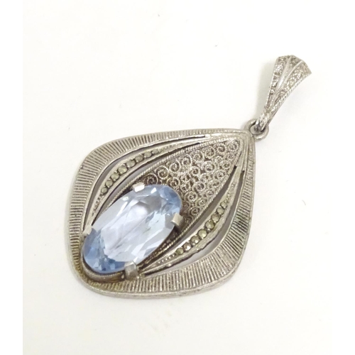 561 - Fahrner Theodor : A 20thC silver pendant set with aquamarine stone and marcasite detail. marked TH s... 