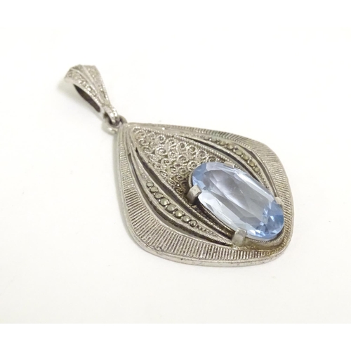 561 - Fahrner Theodor : A 20thC silver pendant set with aquamarine stone and marcasite detail. marked TH s... 