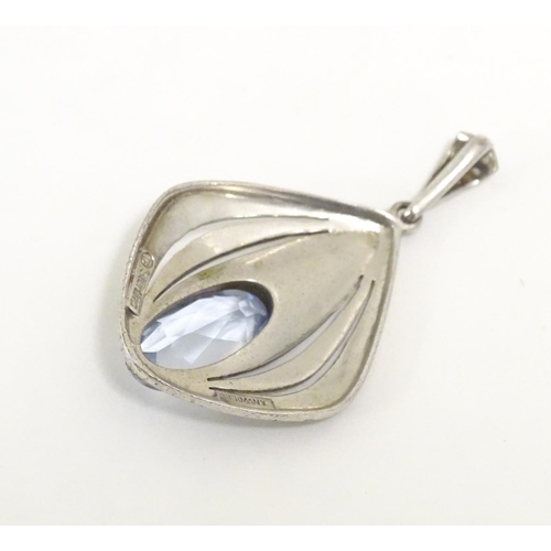 561 - Fahrner Theodor : A 20thC silver pendant set with aquamarine stone and marcasite detail. marked TH s... 