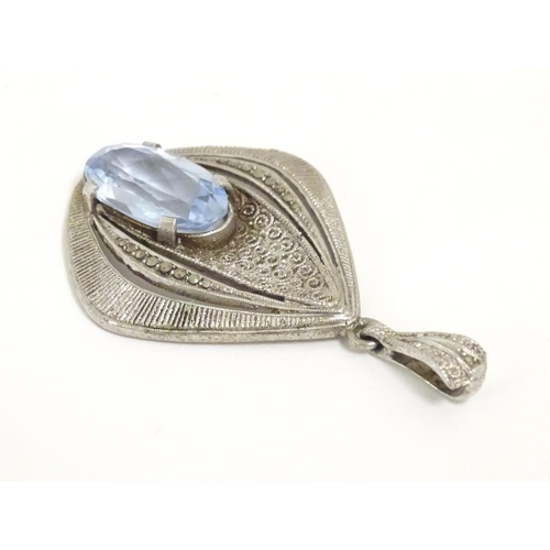 561 - Fahrner Theodor : A 20thC silver pendant set with aquamarine stone and marcasite detail. marked TH s... 