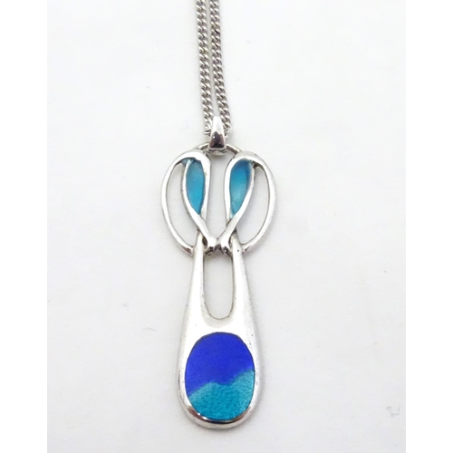 566 - A silver and enamel pedant in the Art Nouveau style 1 1/4