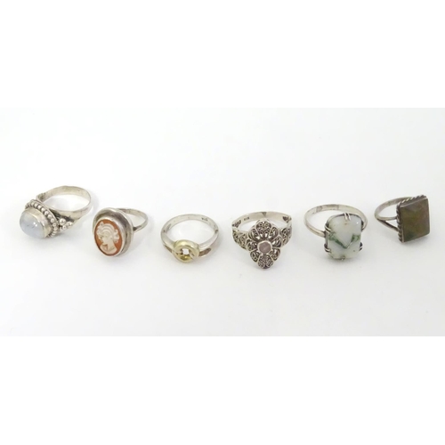 571 - 6 assorted silver and white metal rings, one with cameo detail another with agate. (6)