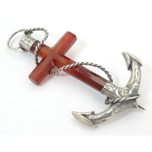 572 - A Victorian brooch formed as an anchor set with carnelian and white metal detail. 3