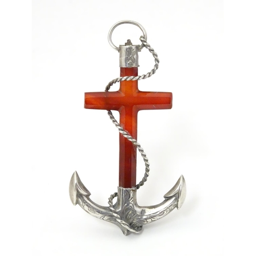 572 - A Victorian brooch formed as an anchor set with carnelian and white metal detail. 3