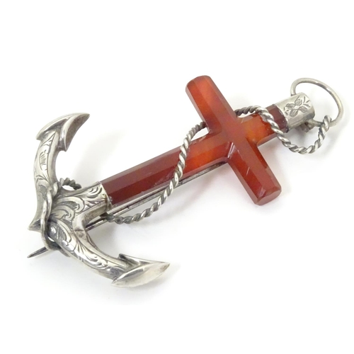 572 - A Victorian brooch formed as an anchor set with carnelian and white metal detail. 3