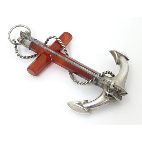 572 - A Victorian brooch formed as an anchor set with carnelian and white metal detail. 3