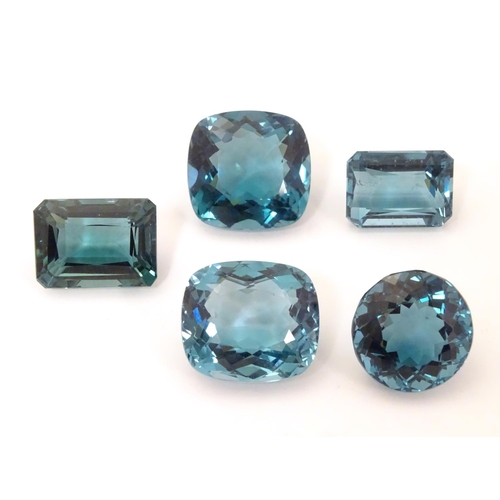 576 - Assorted aquamarine coloured stones . Unmounted. The largest approx 3/4