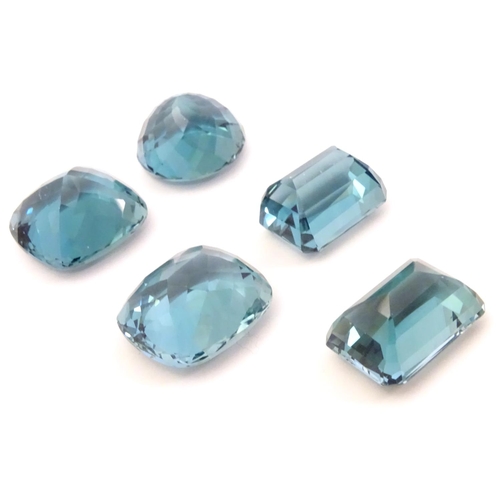 576 - Assorted aquamarine coloured stones . Unmounted. The largest approx 3/4