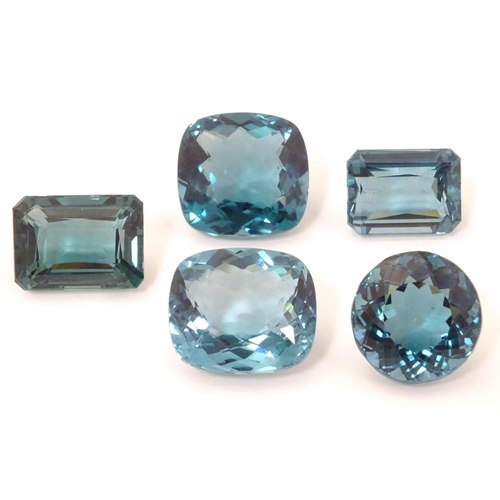 576 - Assorted aquamarine coloured stones . Unmounted. The largest approx 3/4