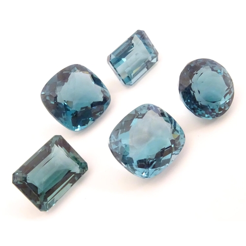 576 - Assorted aquamarine coloured stones . Unmounted. The largest approx 3/4