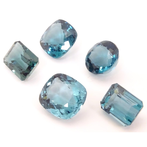 576 - Assorted aquamarine coloured stones . Unmounted. The largest approx 3/4