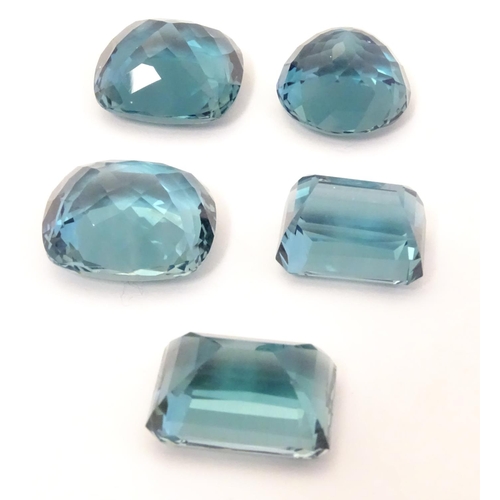 576 - Assorted aquamarine coloured stones . Unmounted. The largest approx 3/4