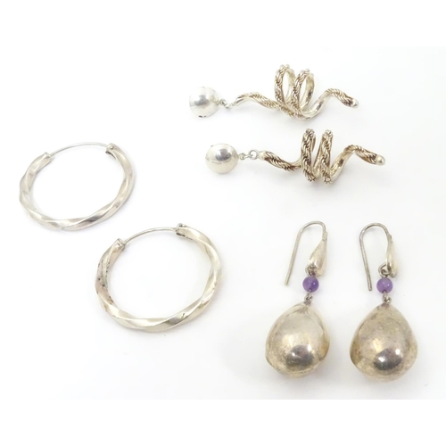 582 - 3 pairs of assorted silver and white metal drop earrings. Approx 2