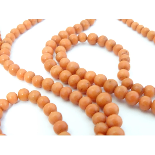 584 - A vintage coral  longuard / necklace of graduated coral beads Approx 30