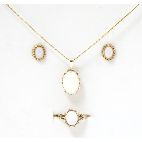 588 - A 9ct gold opal jewellery comprising necklace earrings and rings set with opal cabochon.