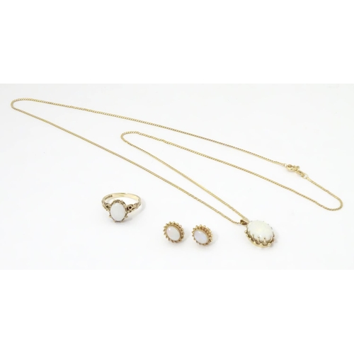 588 - A 9ct gold opal jewellery comprising necklace earrings and rings set with opal cabochon.