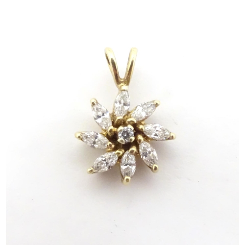 591 - A 9ct gold pendant of flower form set with white stones. 3/4