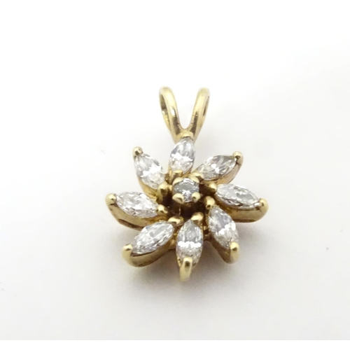 591 - A 9ct gold pendant of flower form set with white stones. 3/4