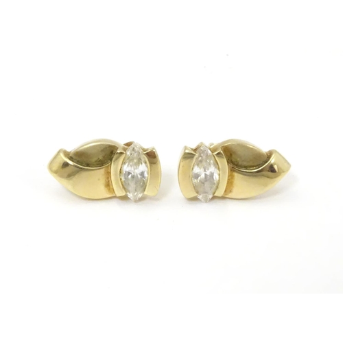 592 - A pair of 9ct gold stud earrings set with white stones