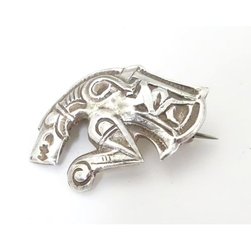 597 - An unusual silver brooch formed as a mythical dragon / horse creature. Possibly Scandinavian 1 1/4