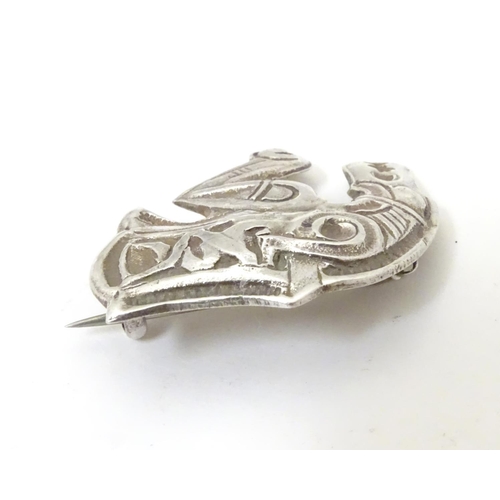 597 - An unusual silver brooch formed as a mythical dragon / horse creature. Possibly Scandinavian 1 1/4