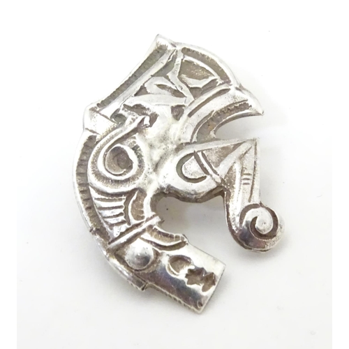 597 - An unusual silver brooch formed as a mythical dragon / horse creature. Possibly Scandinavian 1 1/4