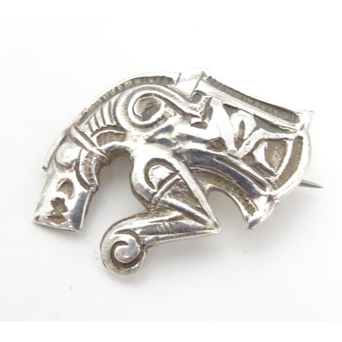 597 - An unusual silver brooch formed as a mythical dragon / horse creature. Possibly Scandinavian 1 1/4