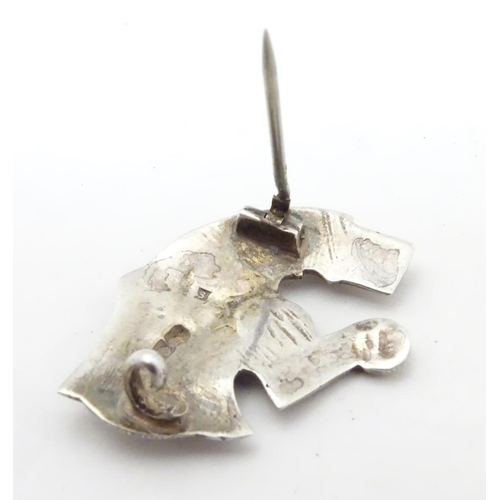 597 - An unusual silver brooch formed as a mythical dragon / horse creature. Possibly Scandinavian 1 1/4