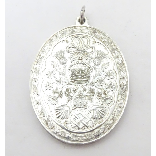 609 - Royal memorabilia : A hallmarked silver commemorative pendant engraved ' Prince Charles & Lady Diana... 