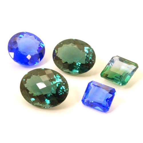 612 - 5 assorted blue / green stones. Unmounted. The largest approx  1