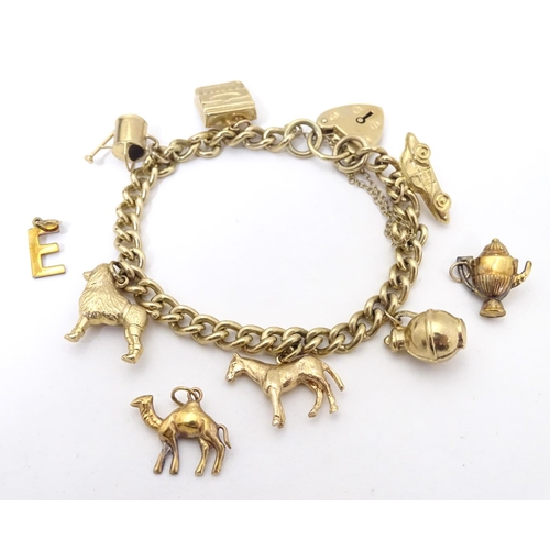 617 - A 9ct gold charm bracelet set with various 9ct gold charms