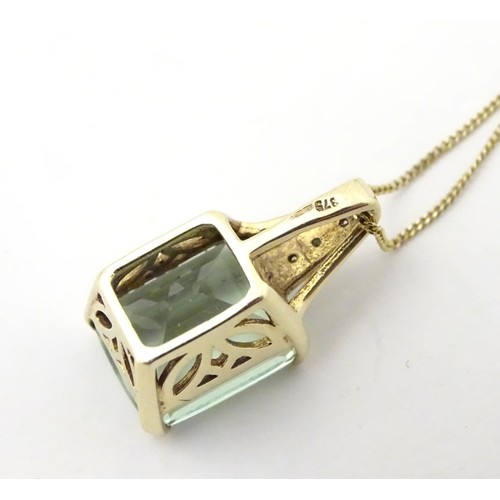 625 - A 9ct gold pendant set with pale green spinel and diamonds on a 16