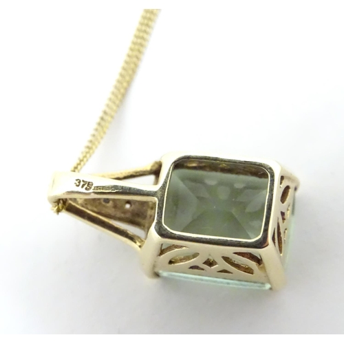 625 - A 9ct gold pendant set with pale green spinel and diamonds on a 16