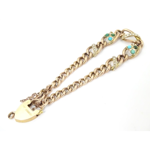 629 - A 9ct gold bracelet set with seed pearl and turquoise in a shamrock setting