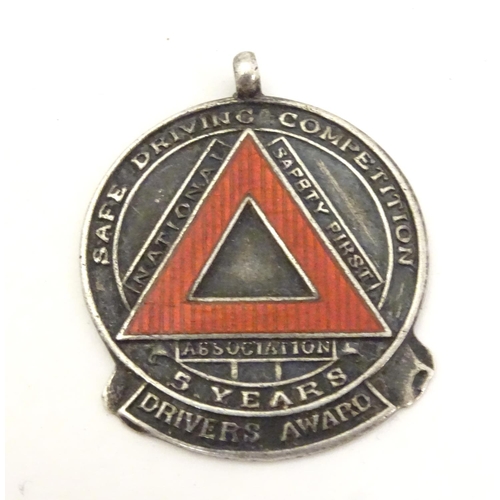 647 - A hallmarked silver fob medal, the obverse decorated with the insignia of the National Safety First ... 