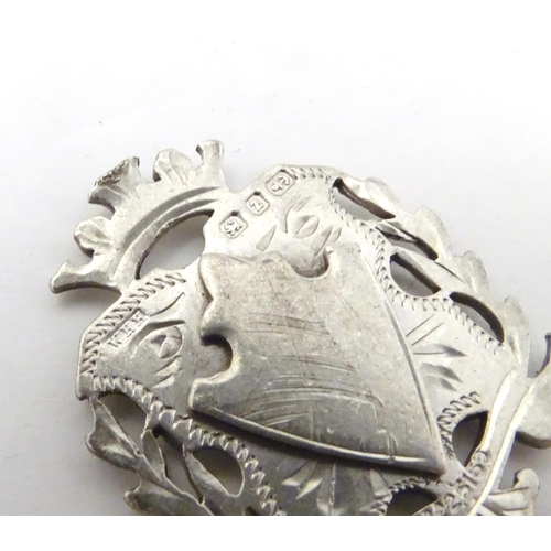 647 - A hallmarked silver fob medal, the obverse decorated with the insignia of the National Safety First ... 