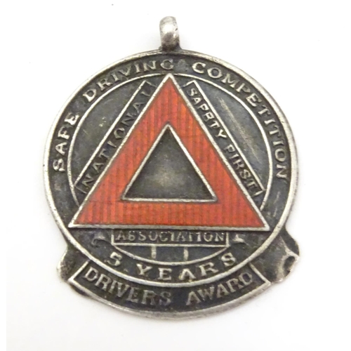 647 - A hallmarked silver fob medal, the obverse decorated with the insignia of the National Safety First ... 