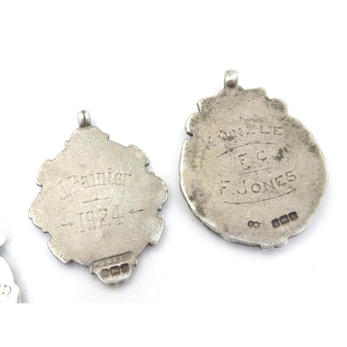 648 - An assortment of early 20thC hallmarked silver fob medals, each obverse with enamelled insignia, the... 