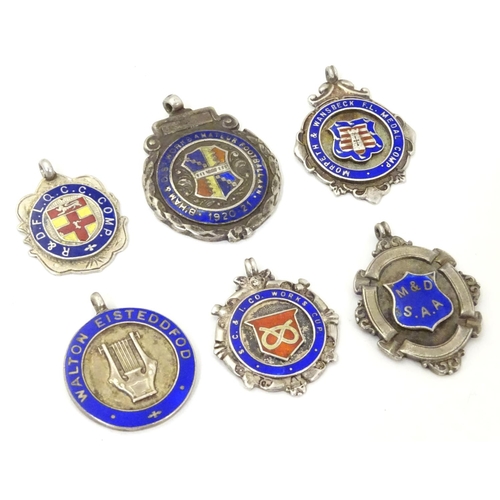 648 - An assortment of early 20thC hallmarked silver fob medals, each obverse with enamelled insignia, the... 